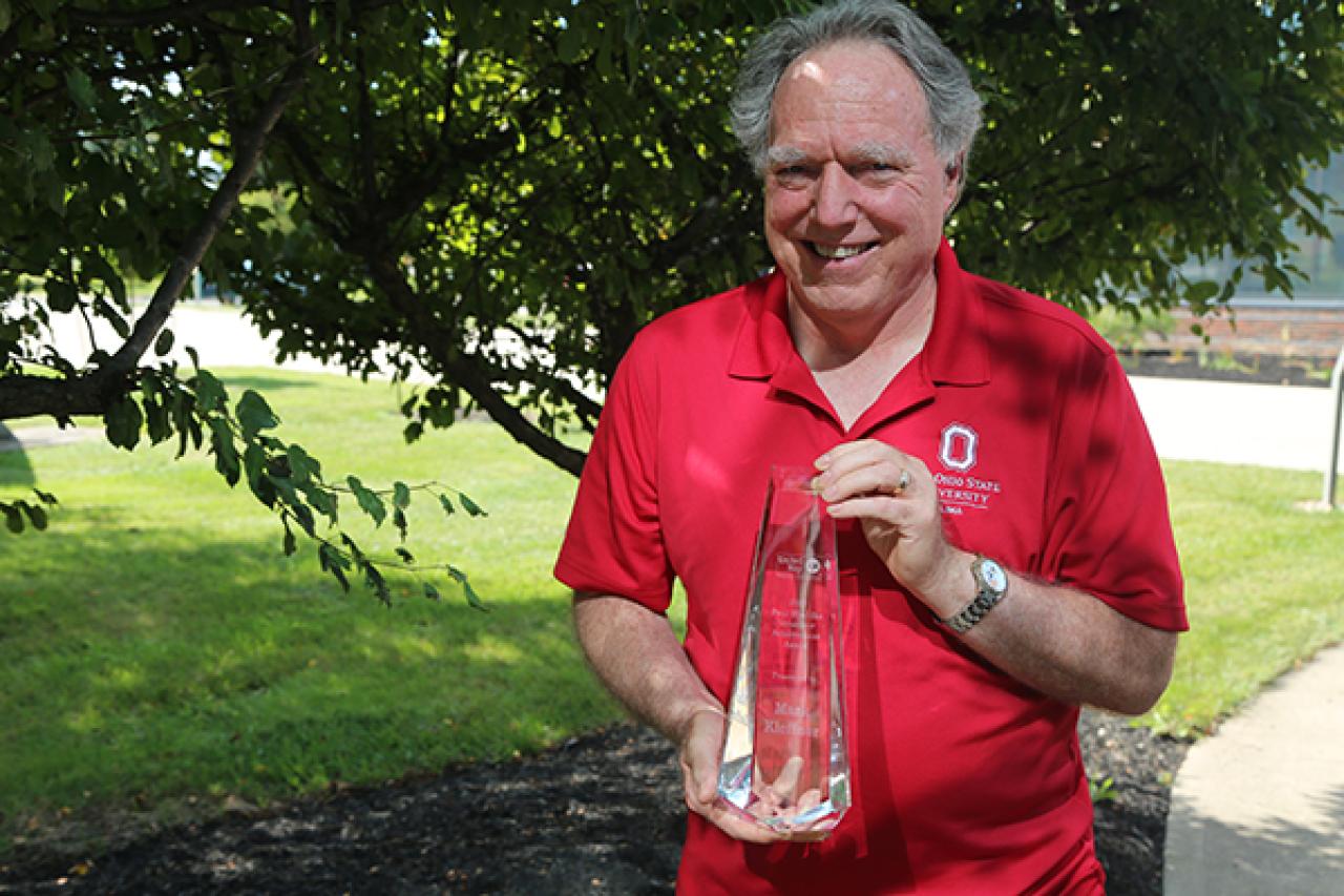 Mark Kleffner holds a United Way award