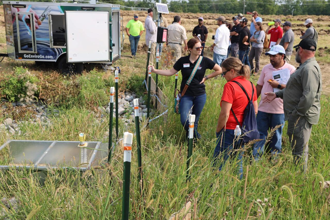 Participants examine water input systems