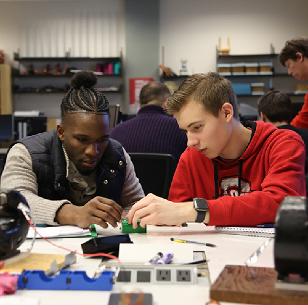 two male students in an engineering lab setting 