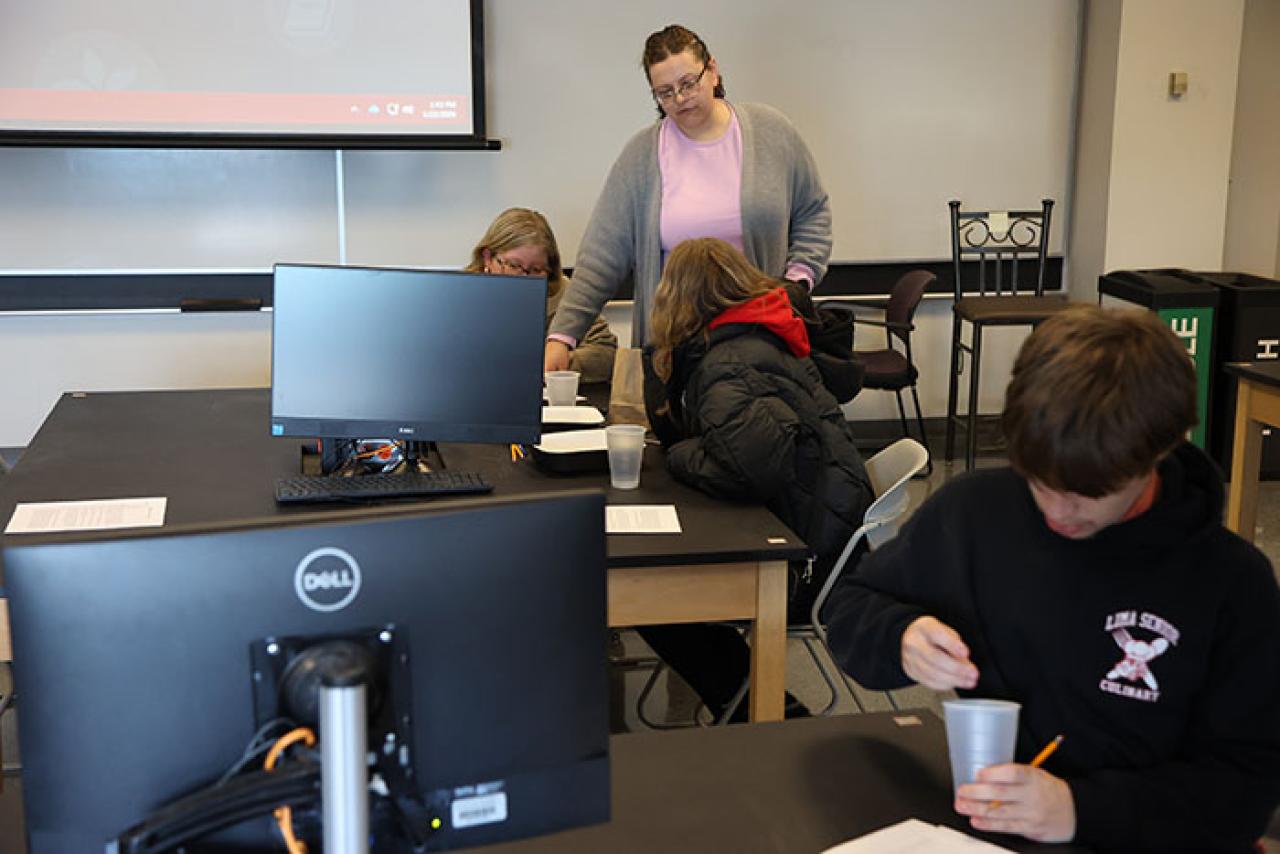 Robin Bagley with students in a biology classroom
