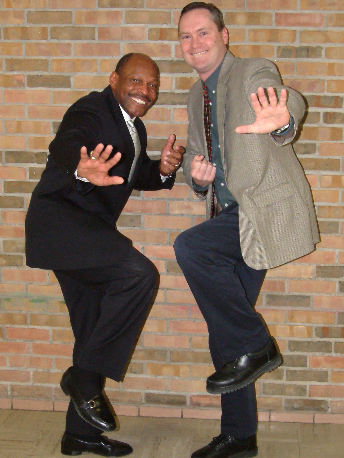 Archie Griffin and Joe Green strike the Heisman stance