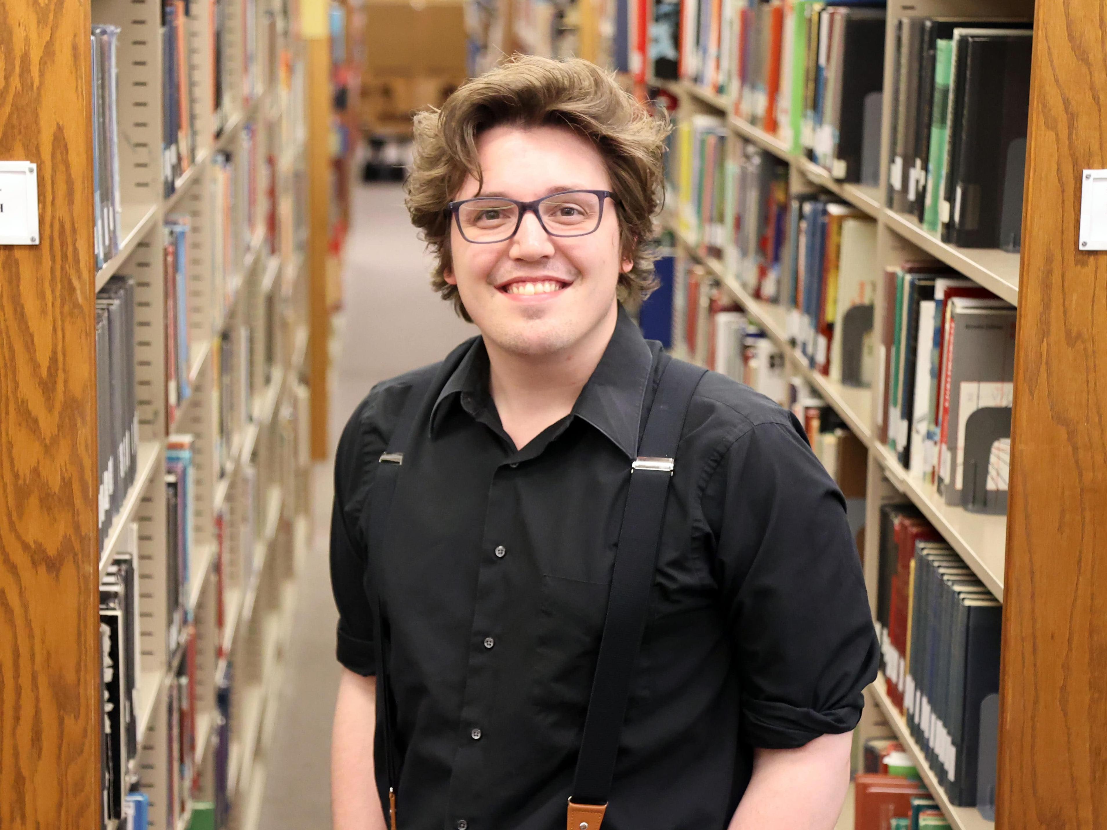 Zach Walton in the Lima Campus Library