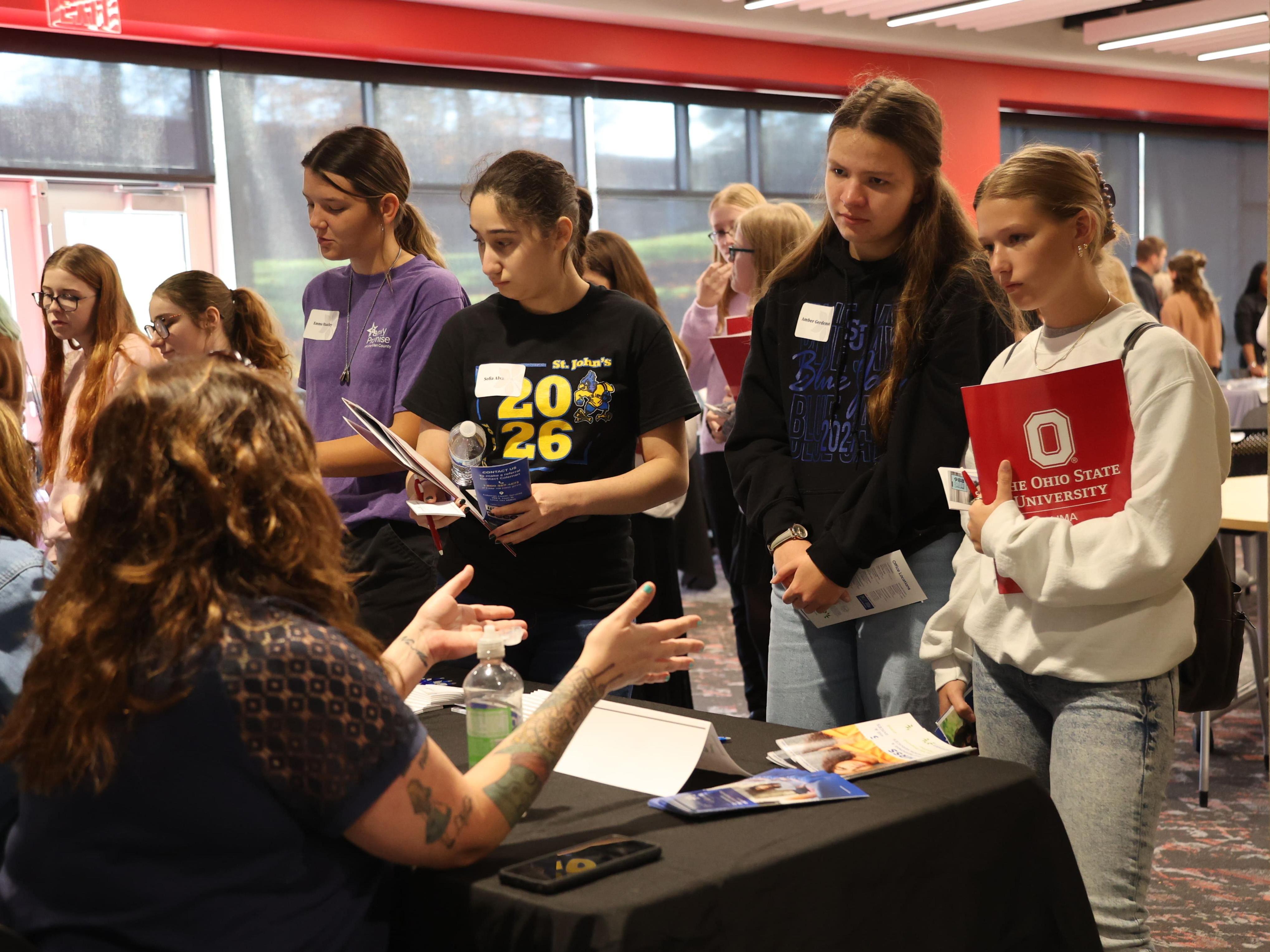 High school students talk to a social worker at Ohio State Lima