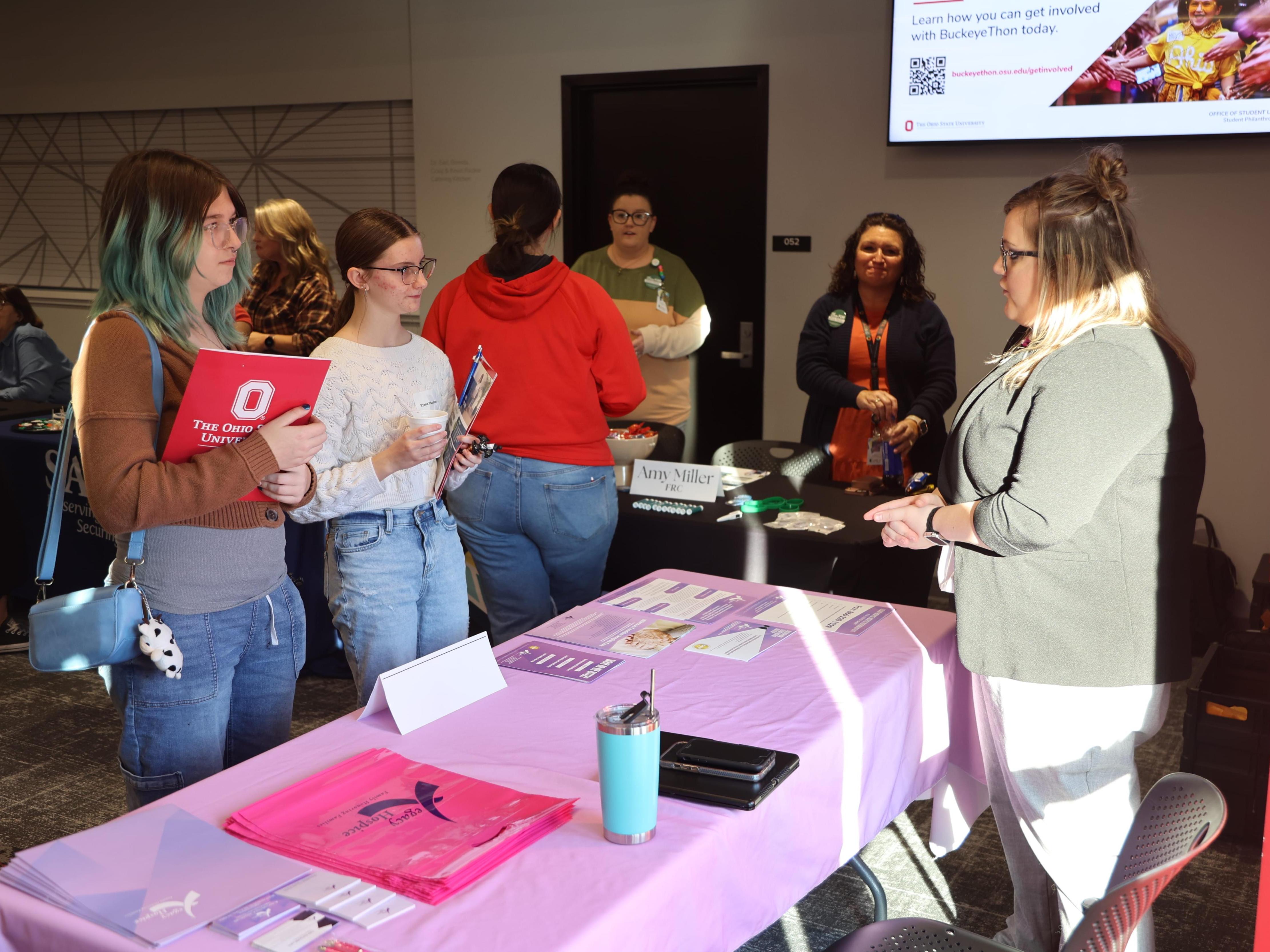 High school students talk to a social worker at Ohio State Lima