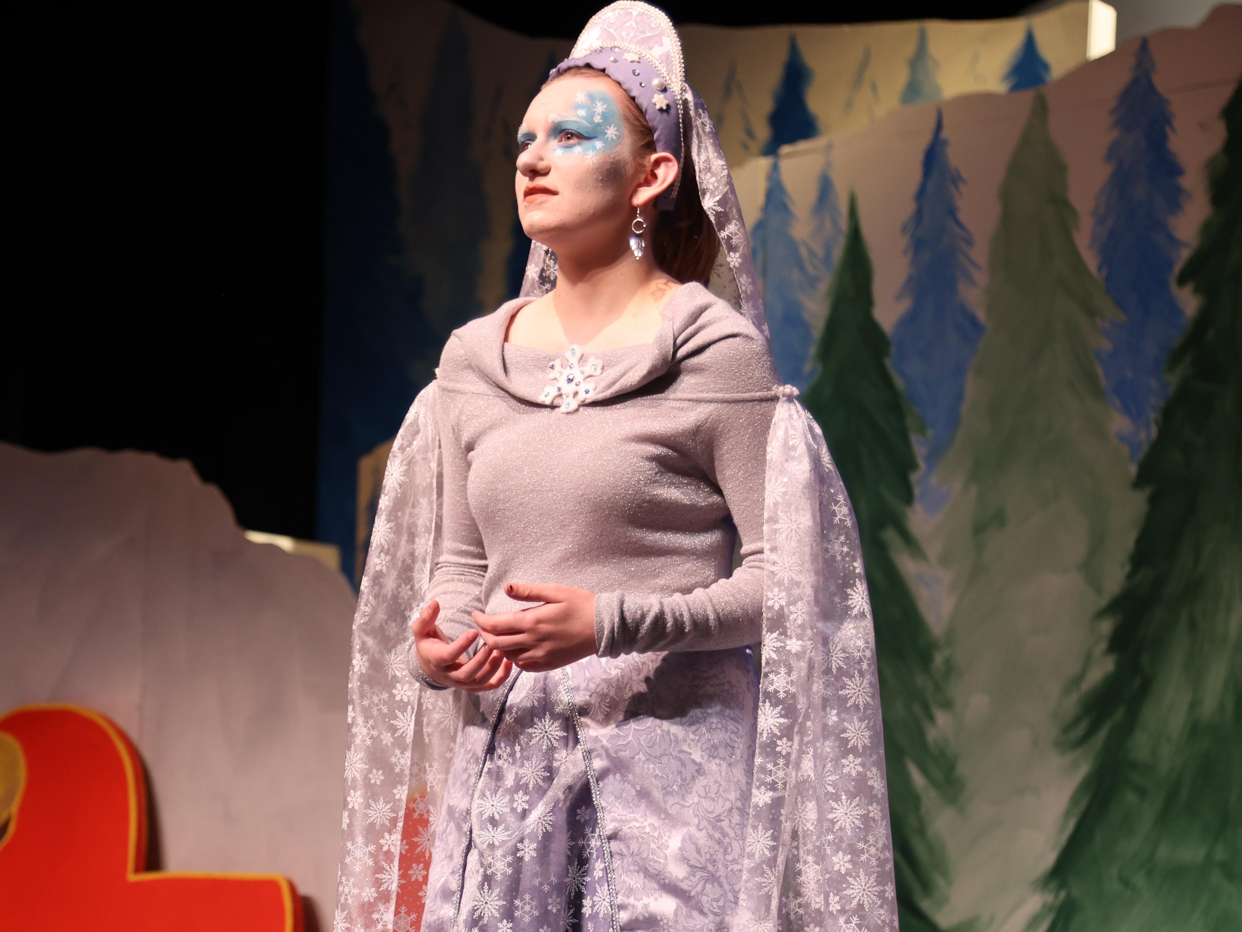 The Snow Queen in a glittering dress on stage