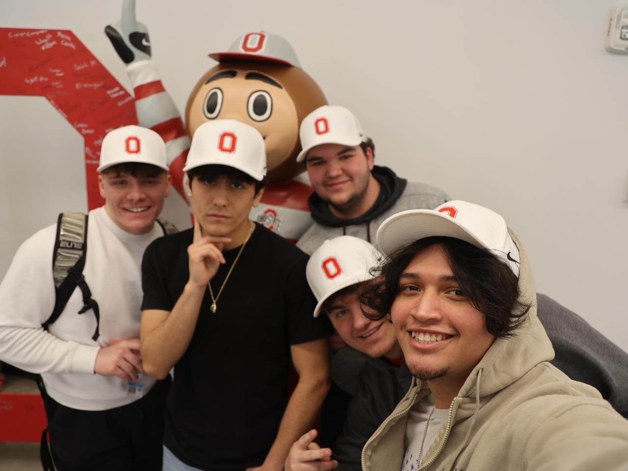 Ohio State Lima students show off their new hats