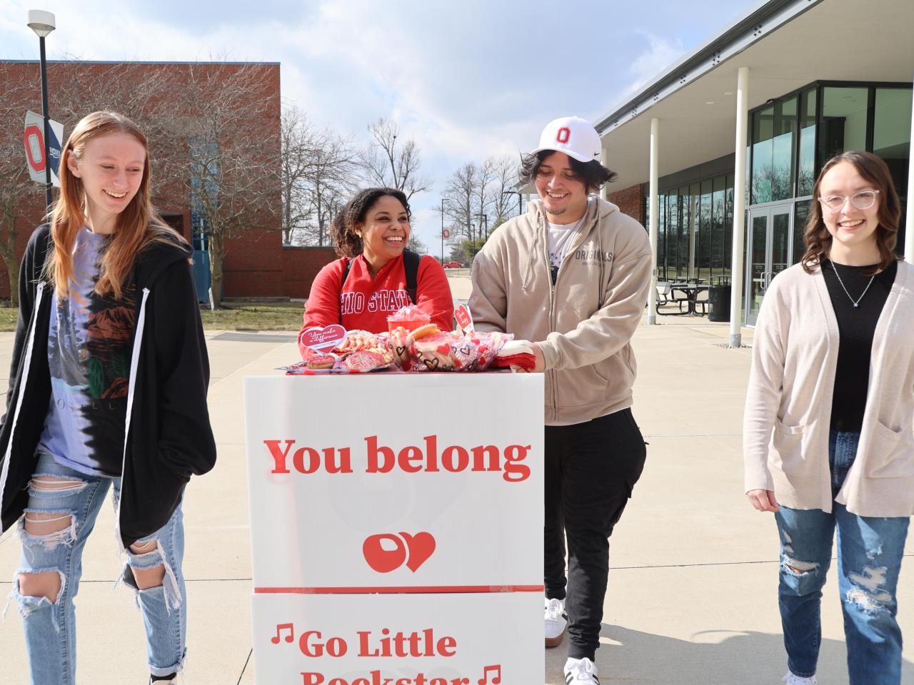 Students push the Buckeye Love treat cart on the Quad