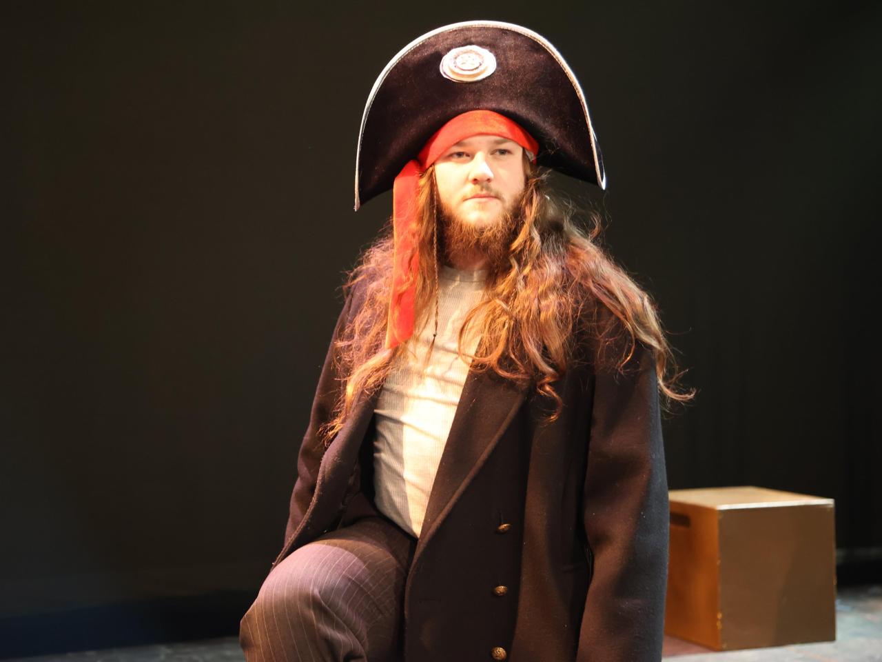 A man in a pirate hat