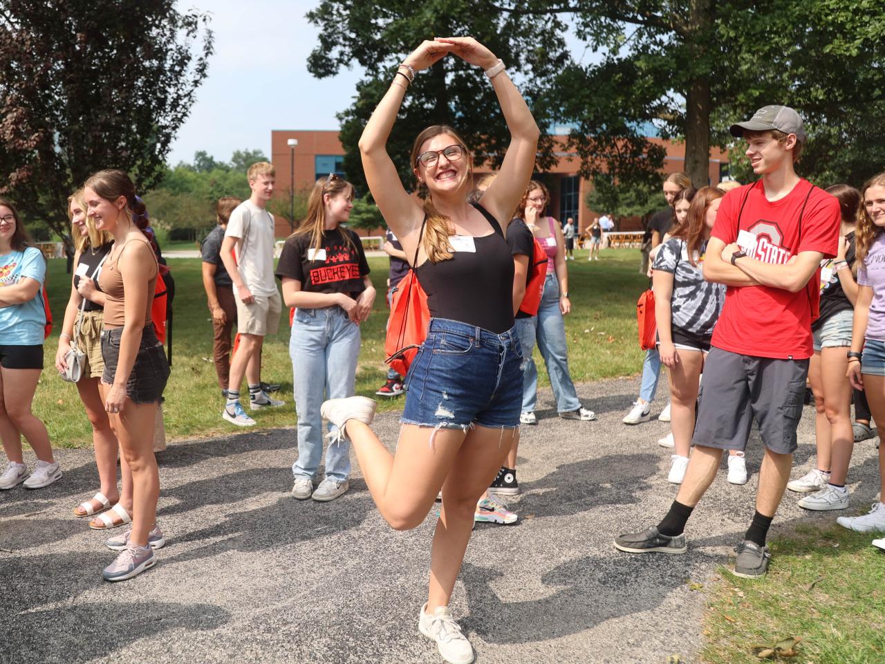 Student does a Block O on the Quad at Ohio State Lima during Dean's Convocation