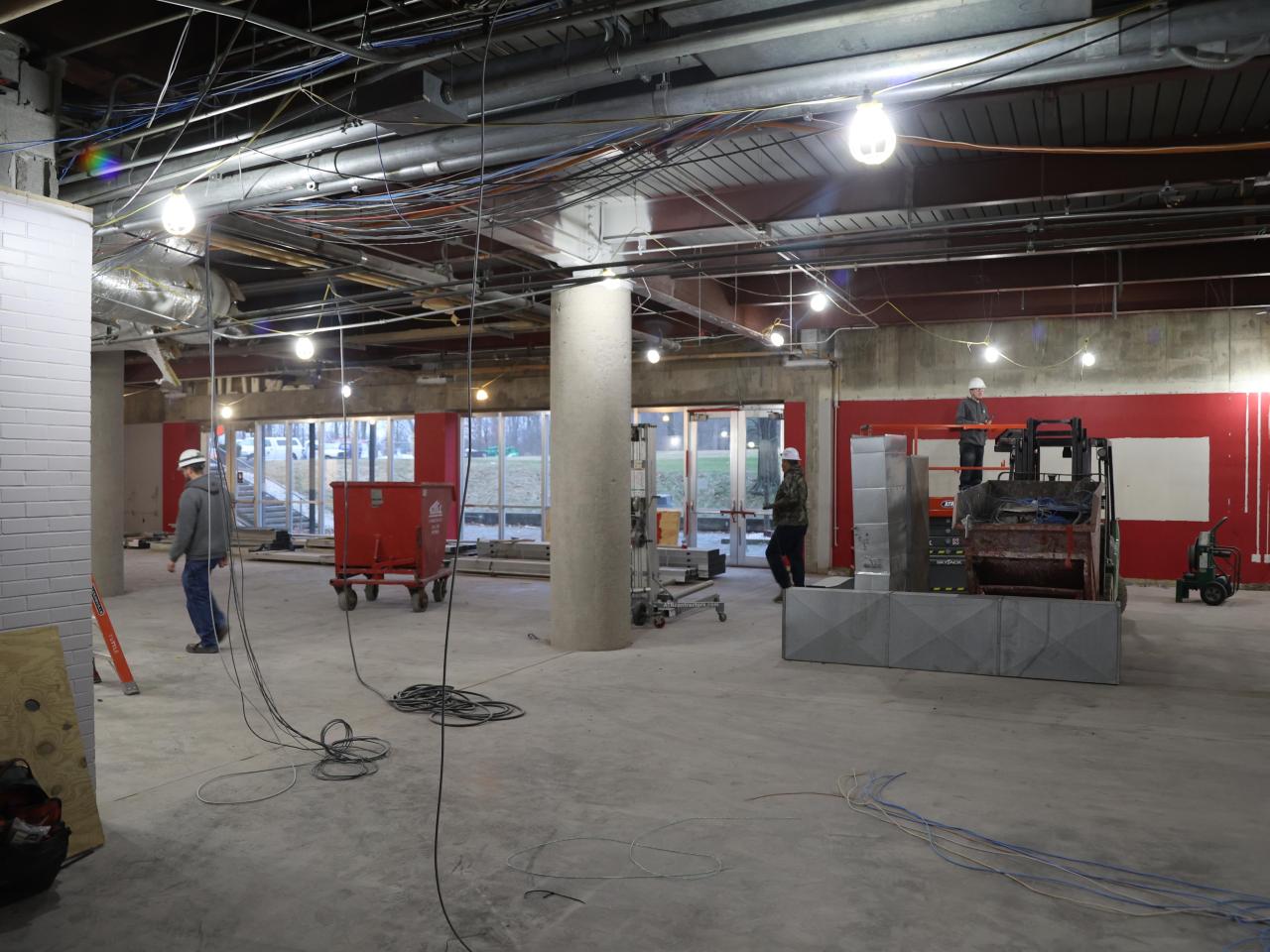 Construction workers using equipment in Galvin basement 2023-01-13-1
