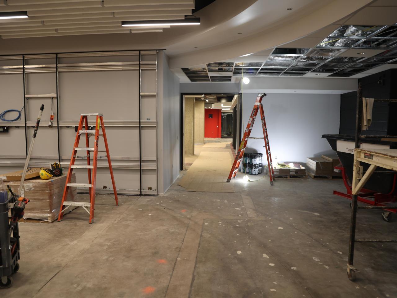 brackets on walls, some lights installed with construction equipment in galvin basement 2023-06-23-2