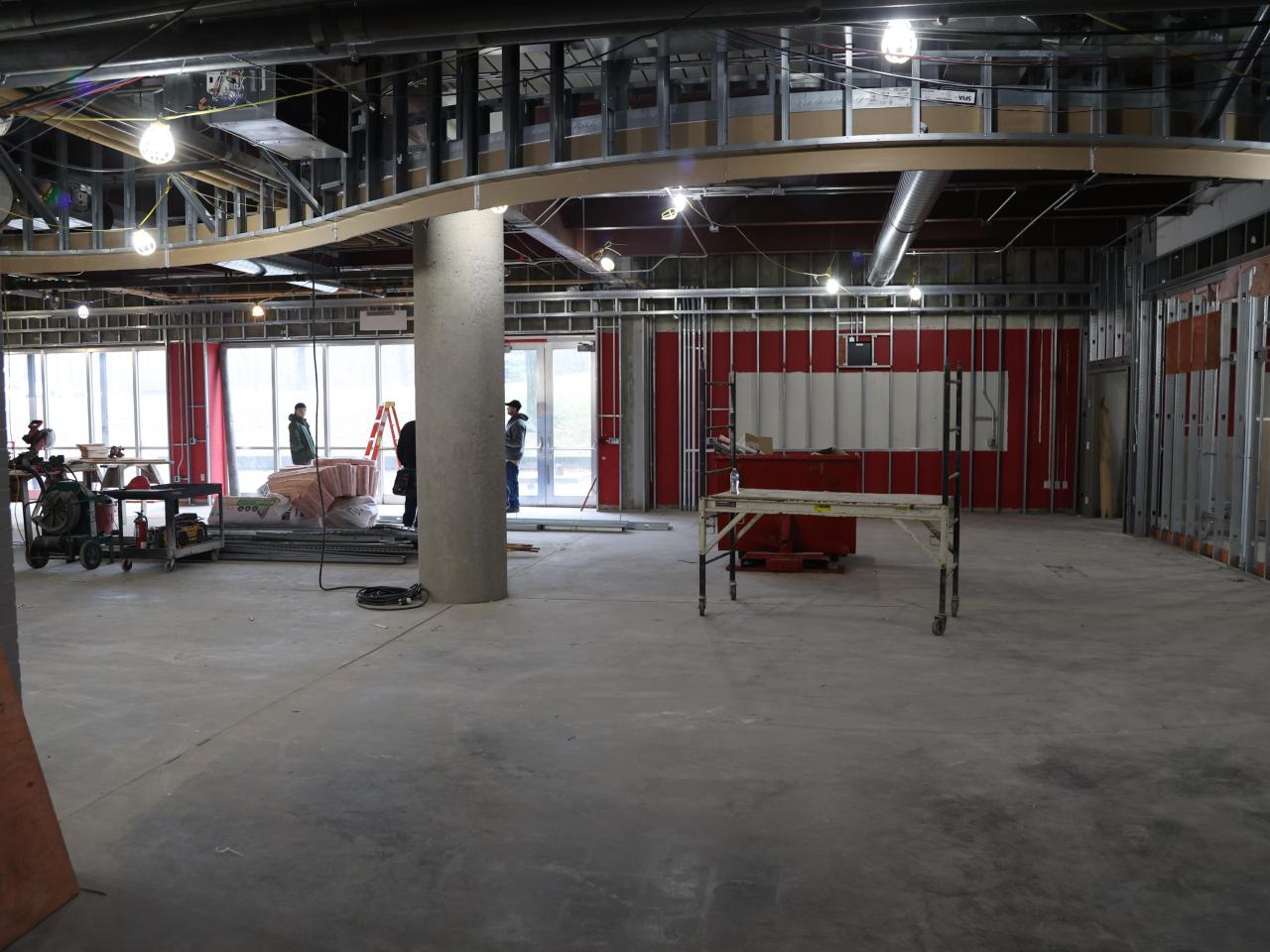 ceiling framework, wall framework and construction workers in background in galvin basement 2023-03-03-1