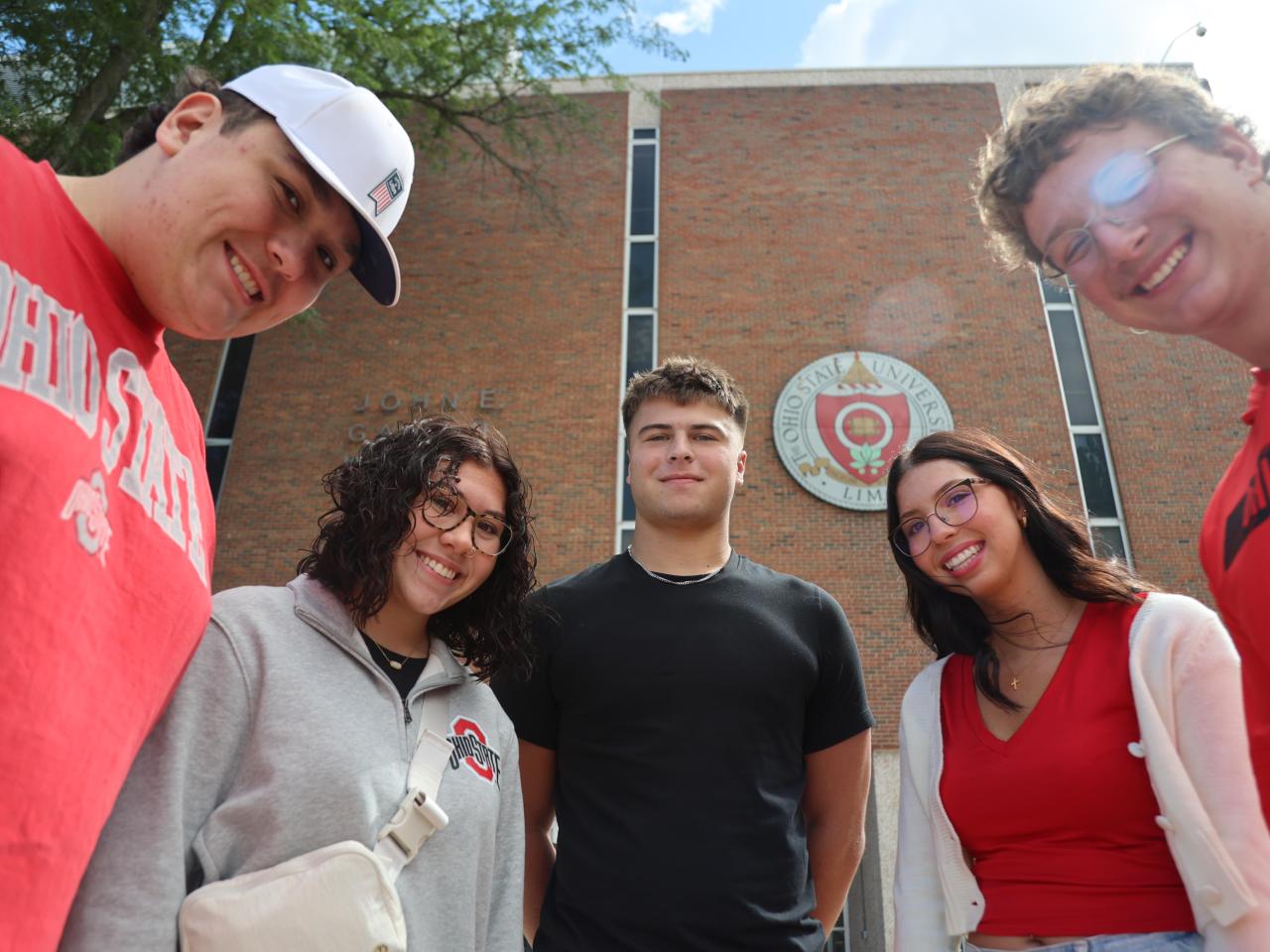 Students gather in a circle in front of Galvin Hall