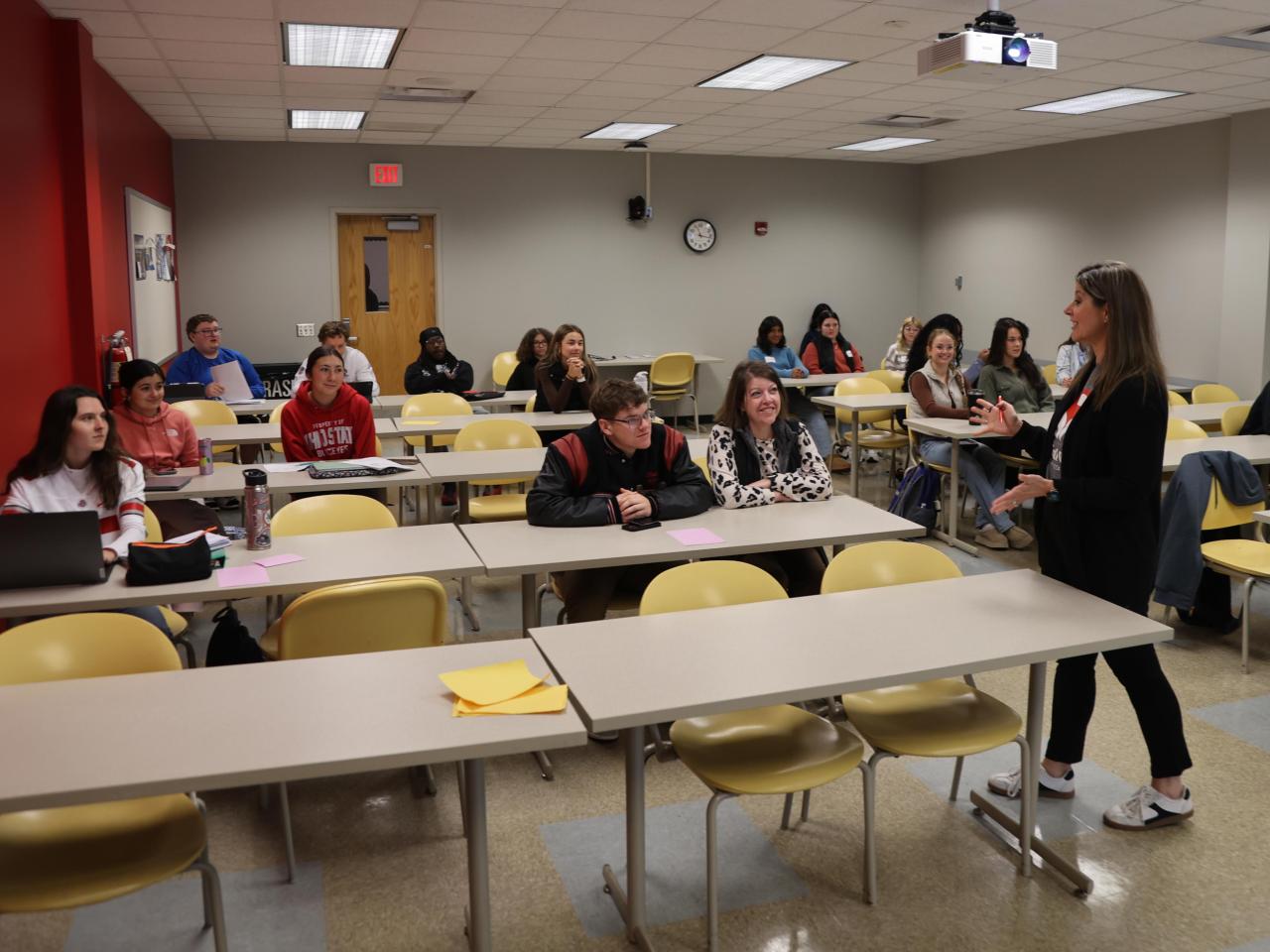 A professor talks to a classroom of students