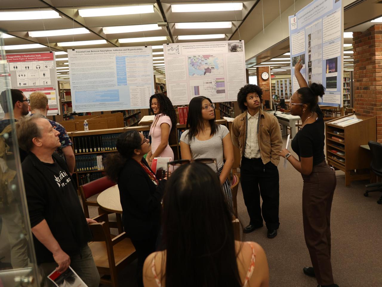Students present their research to a group