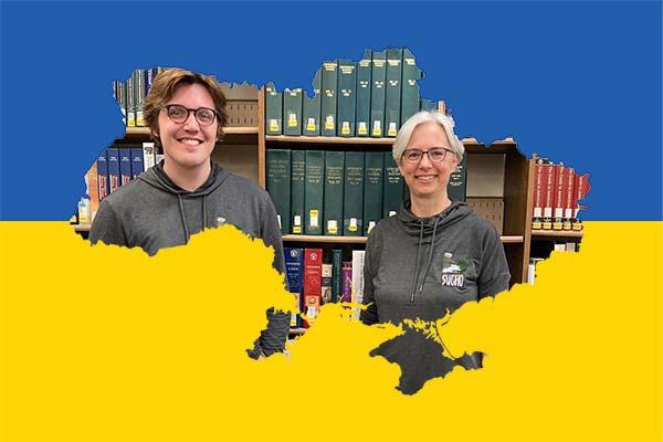 librarians Zach Walton and Tina Schneider in a Ukrainian map