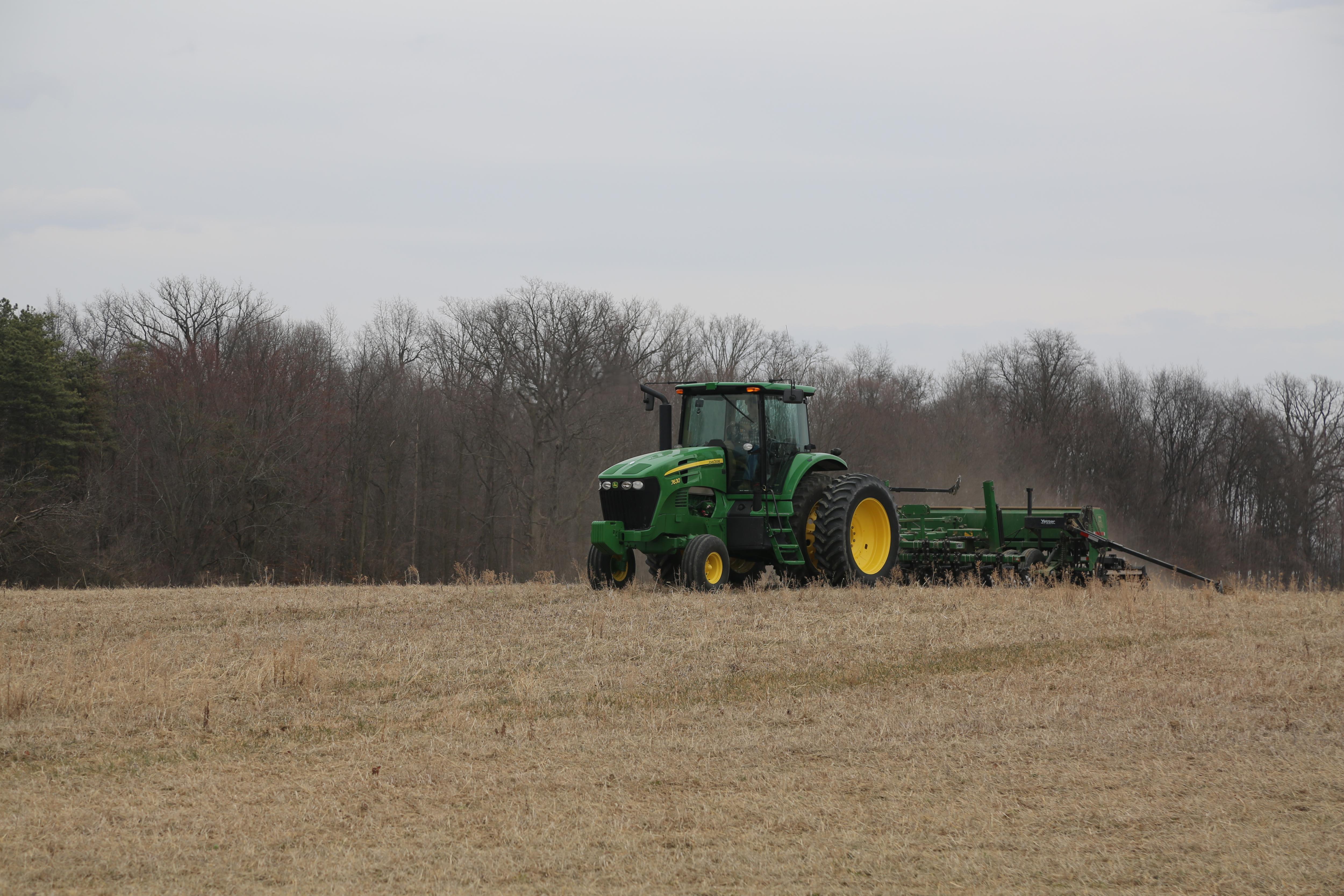 Tractor planting in a field at Ohio State Lima