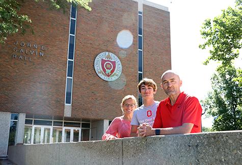 Kristen, Riley and Adam Ferguson in front of Galvin Hall