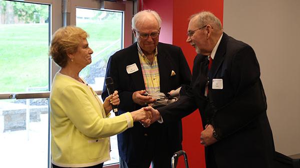 Violet Meek and Jon Rockhold present award to John Snyder (right)
