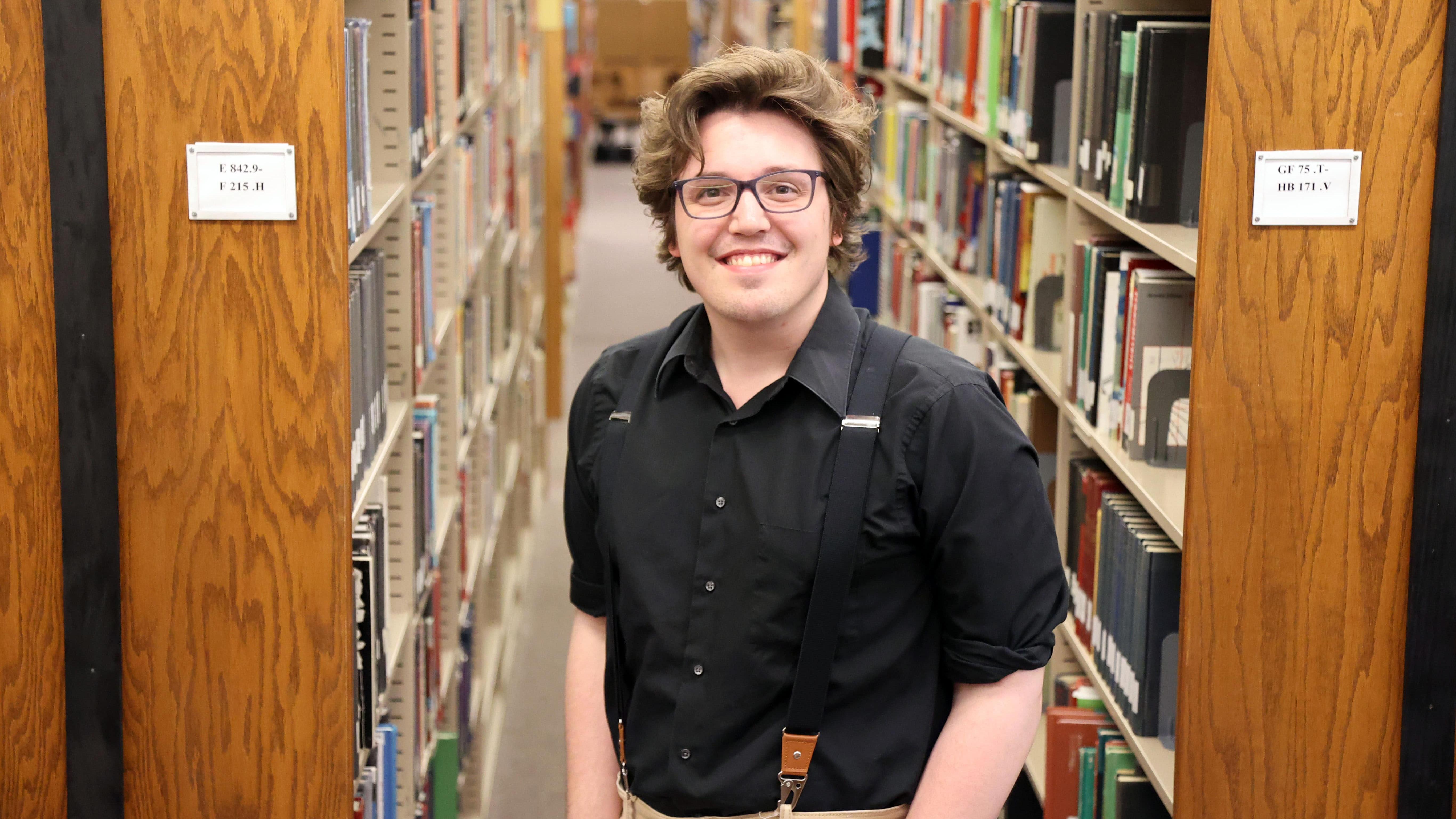 Zach Walton in the Lima Campus Library
