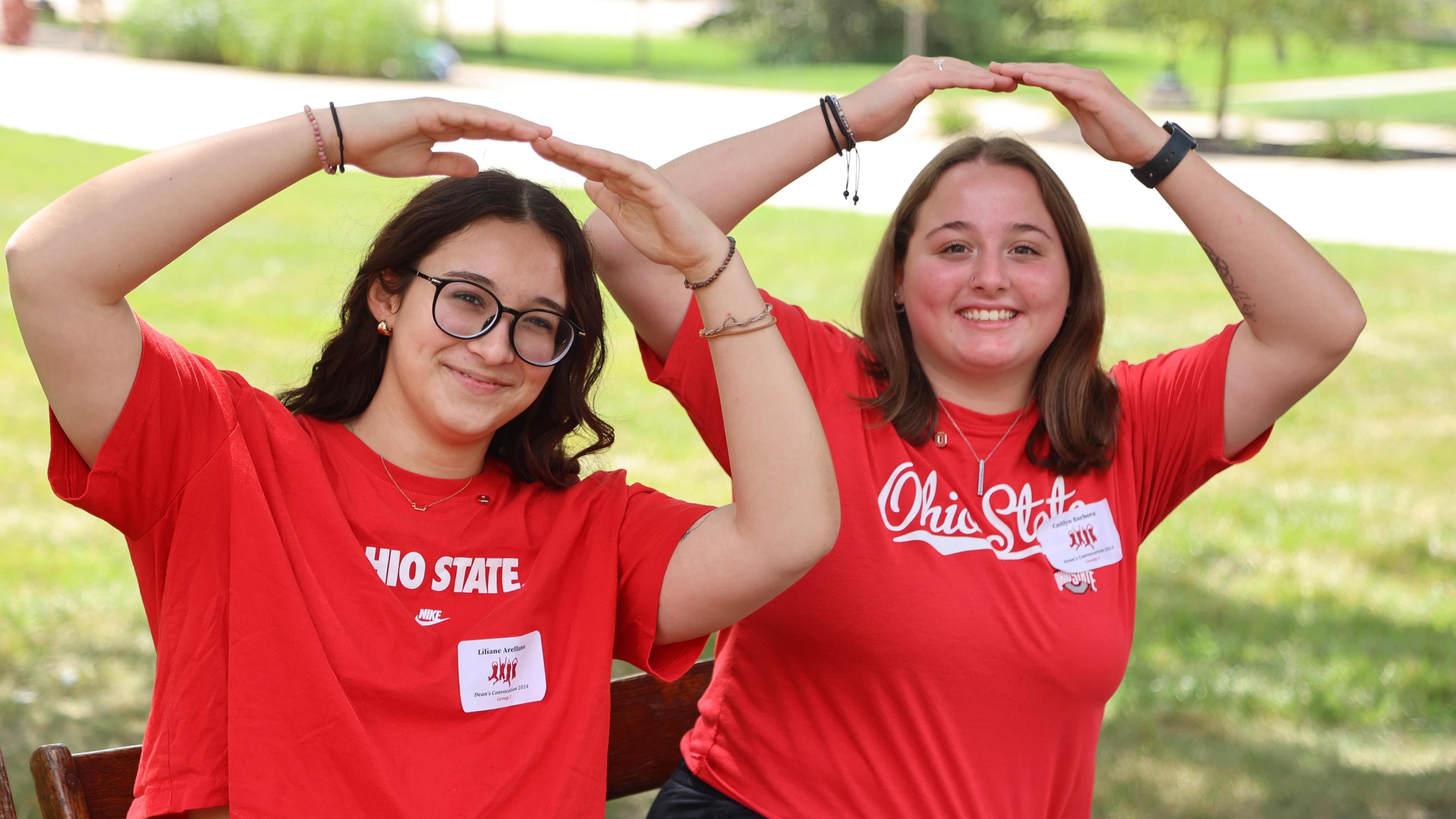 Two Ohio State Lima students spell "OH" at Dean's Convocation 2024