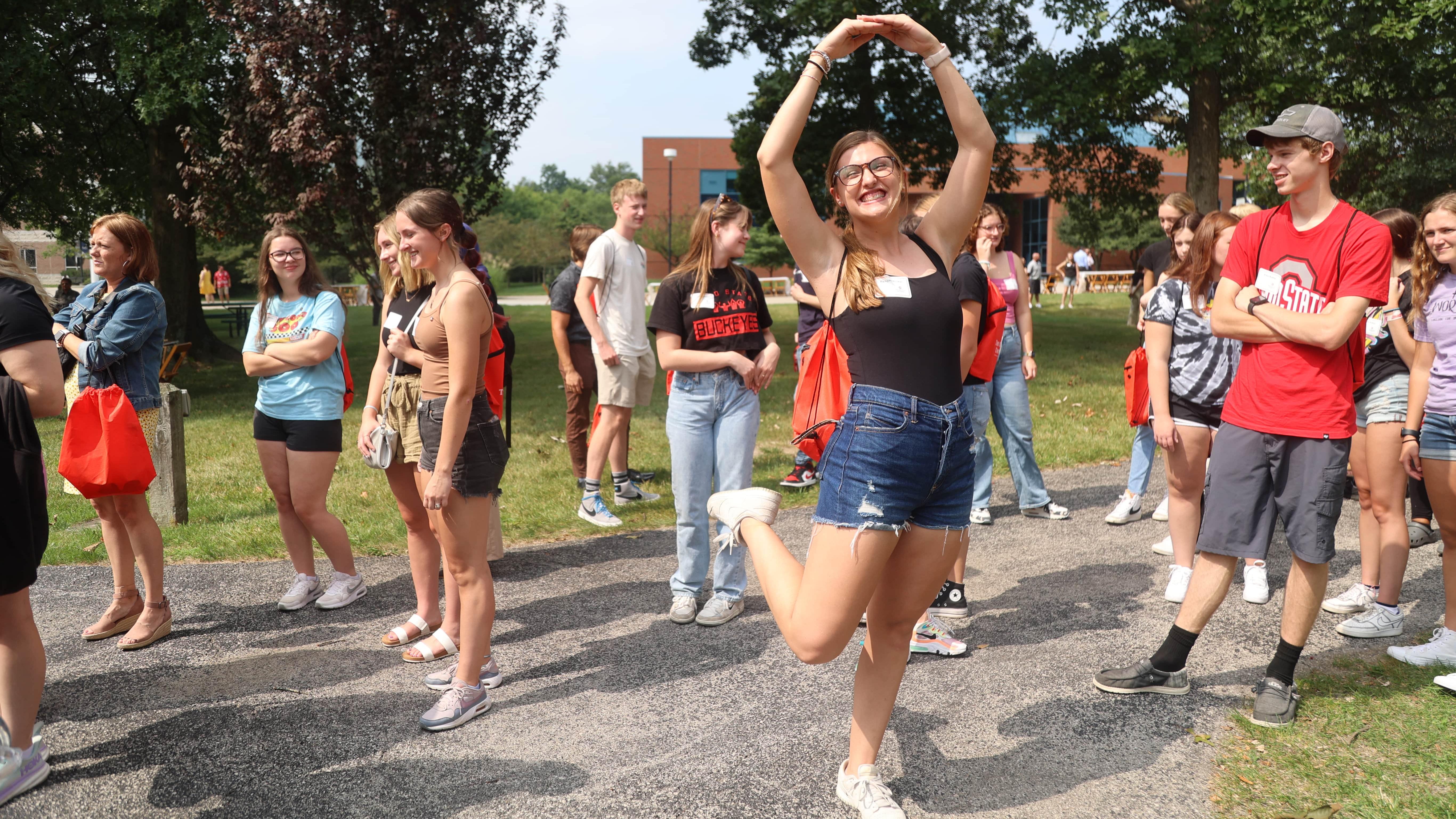 Student does a Block O on the Quad at Ohio State Lima during Dean's Convocation