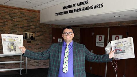 Alumnus Alec Keller holds issues of the Kenton times