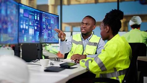 Workers peruse computer screens