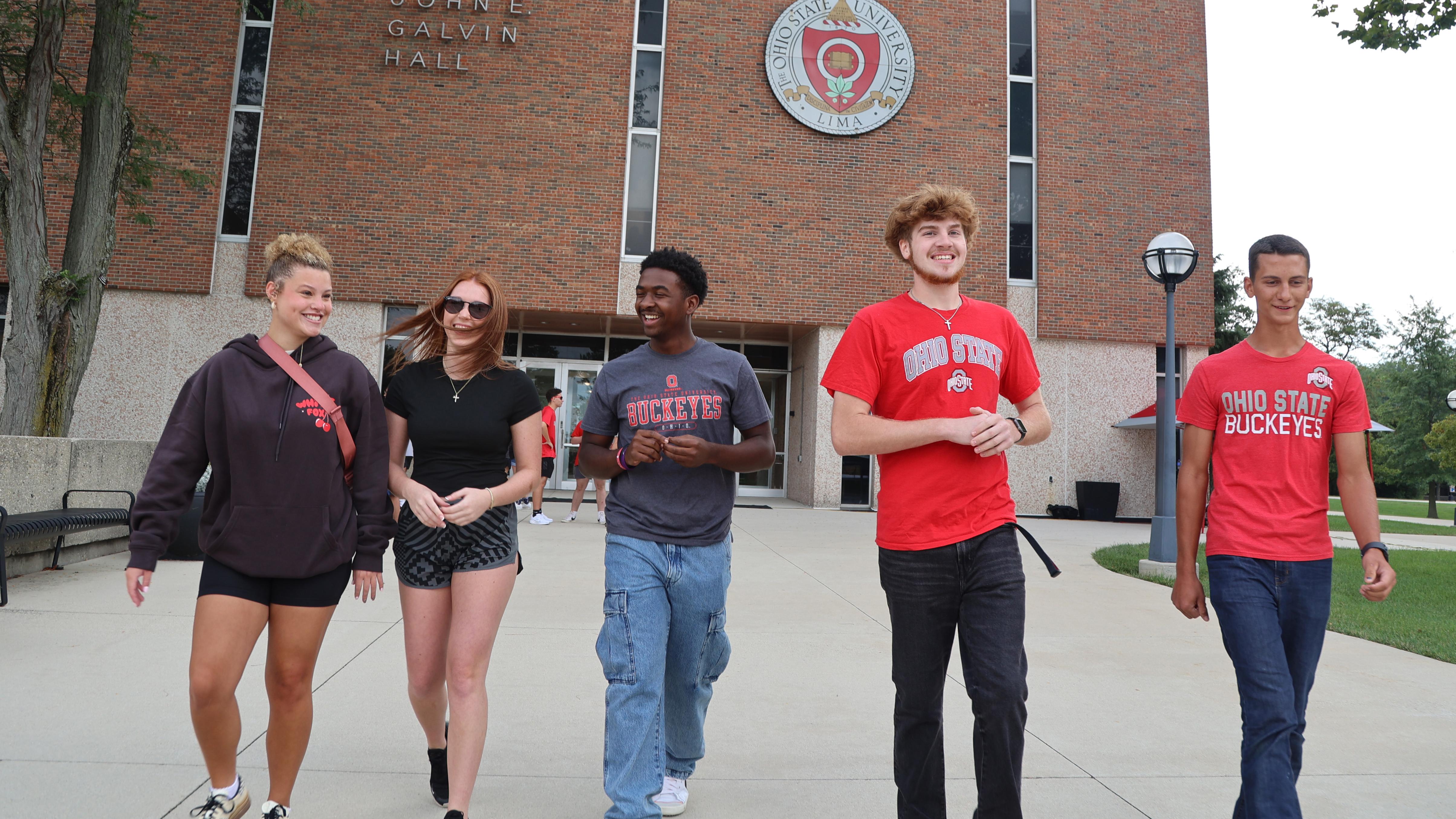 Five students walk away from Galvin Hall