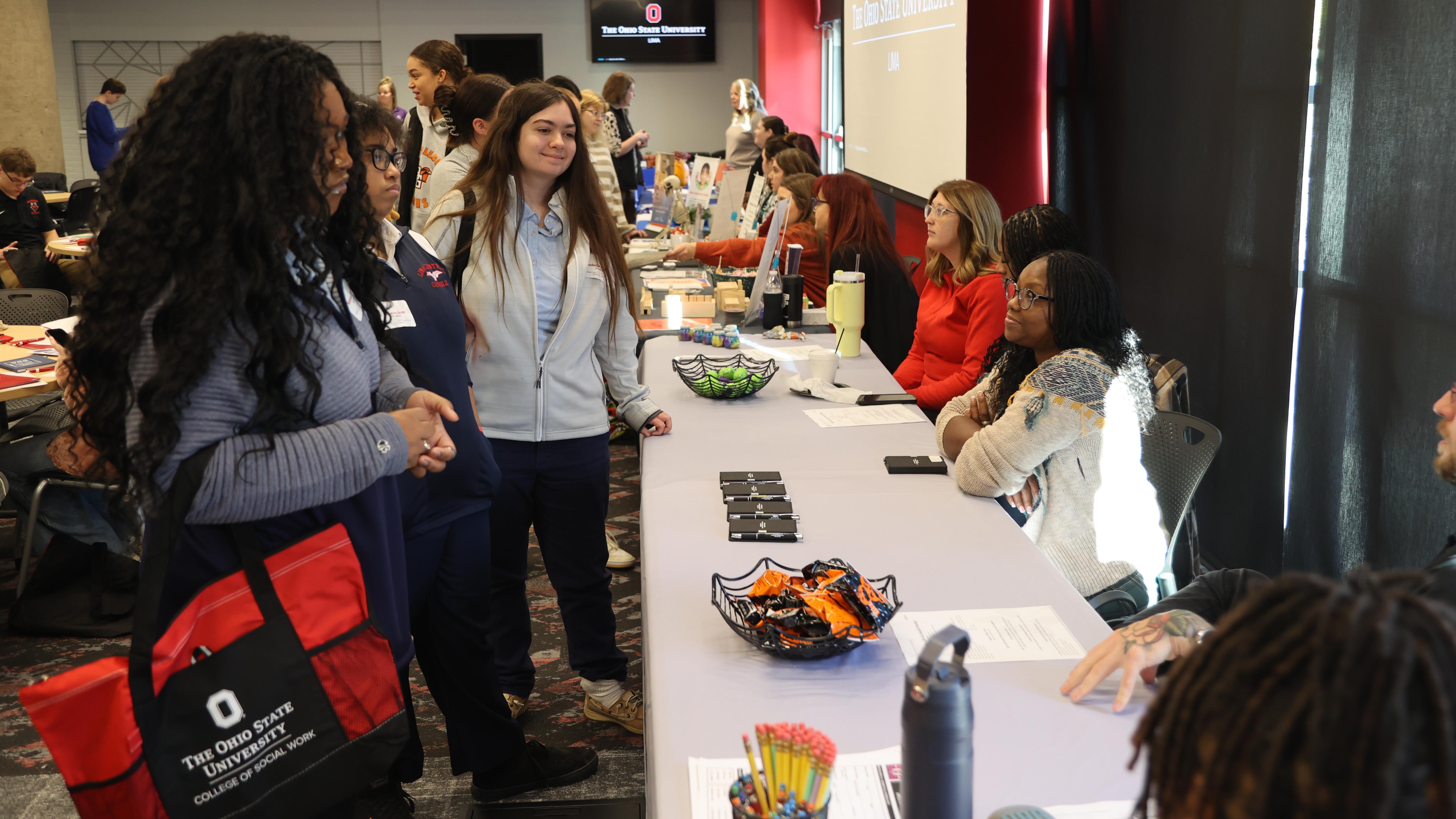 High school students take to social workers from a local agency