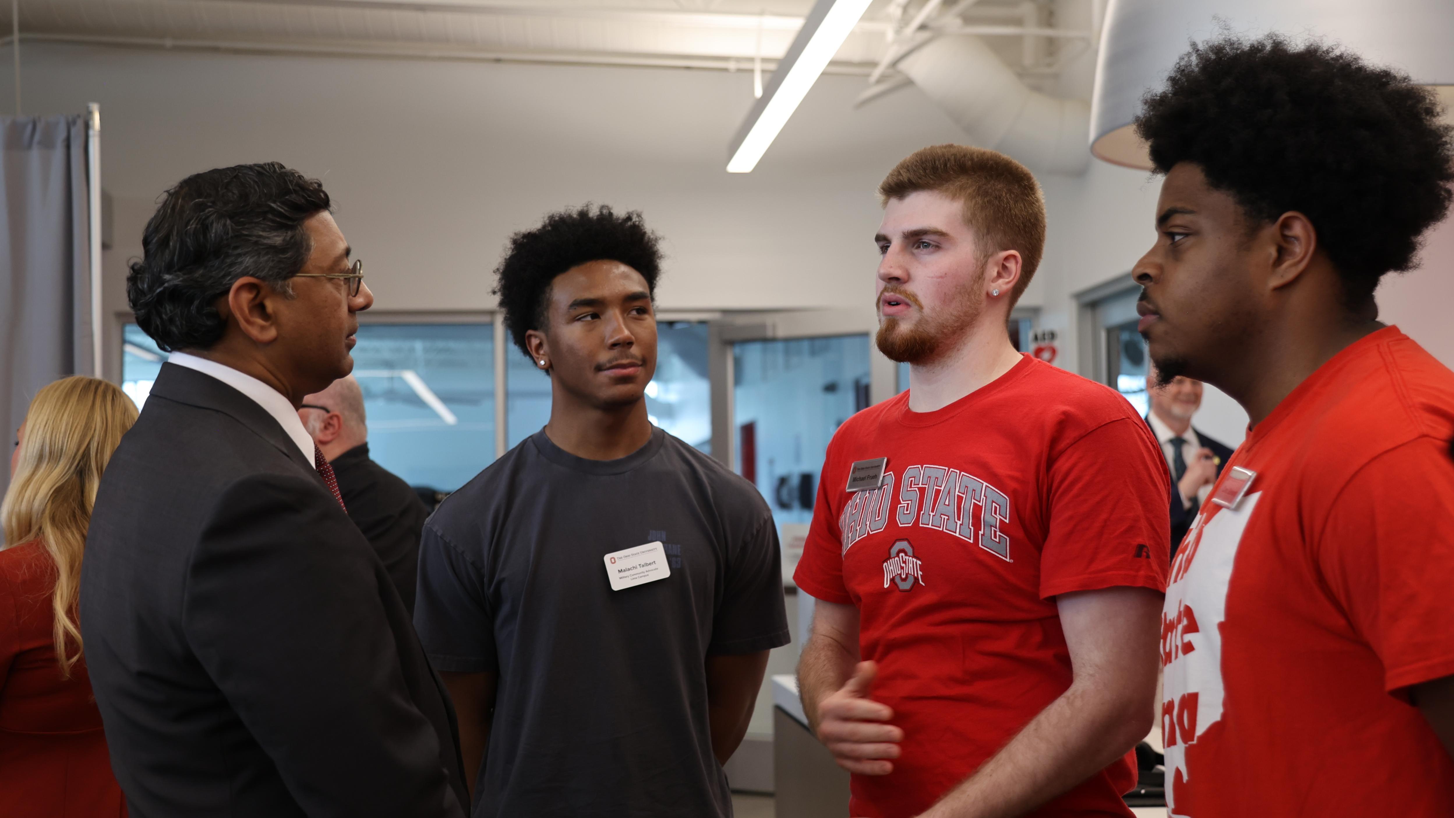 Four students talk to the Ohio State president
