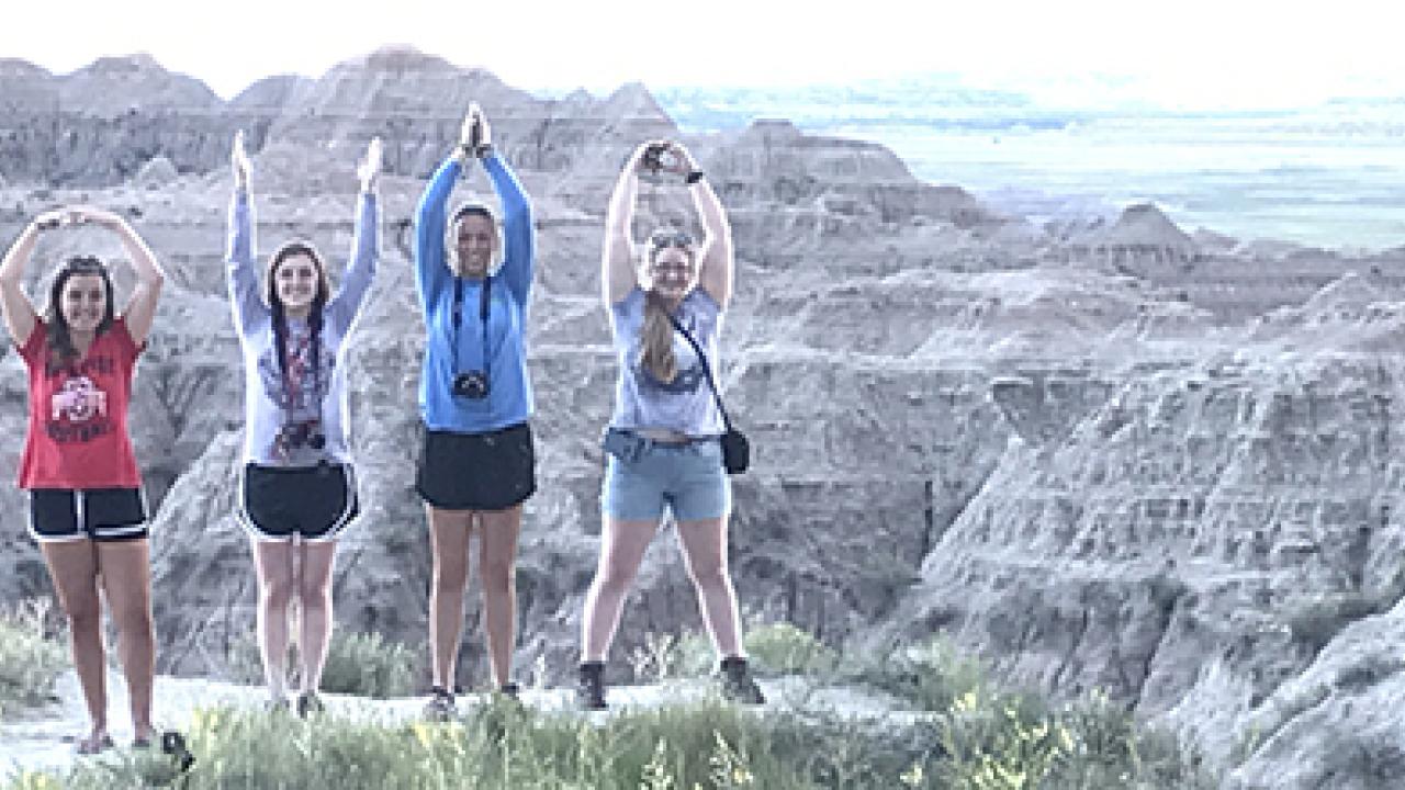 Students on a mountain spelling out OHIO