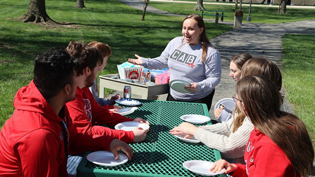 Crystal Altstaetter works with Campus Activities Board on the Quad