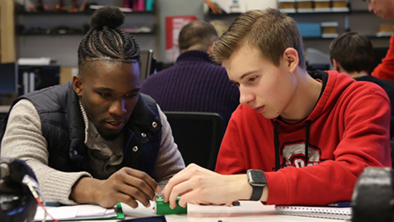 two male students in an engineering lab setting 